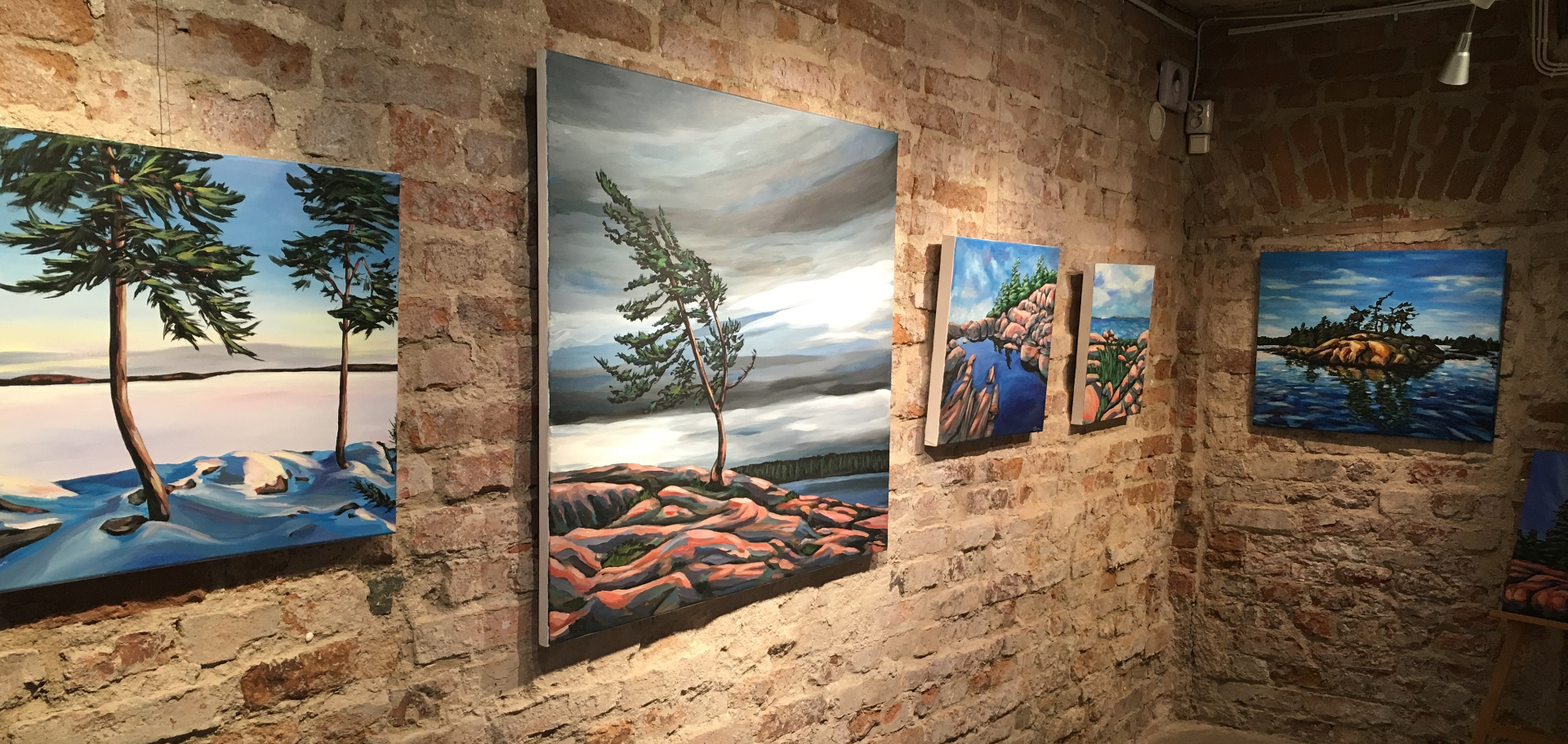 Windward Studio paintings installed in an exhibition
